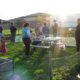People gathering around community garden at East Madison Community Center