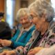 Joyful Bingo Night at Nursing Home with Residents Engaged in Friendly Competition